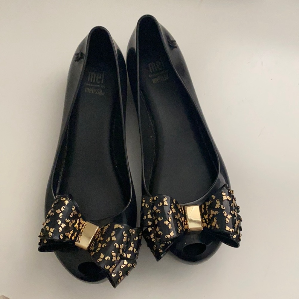 Mel by Melissa black flats with gold bow